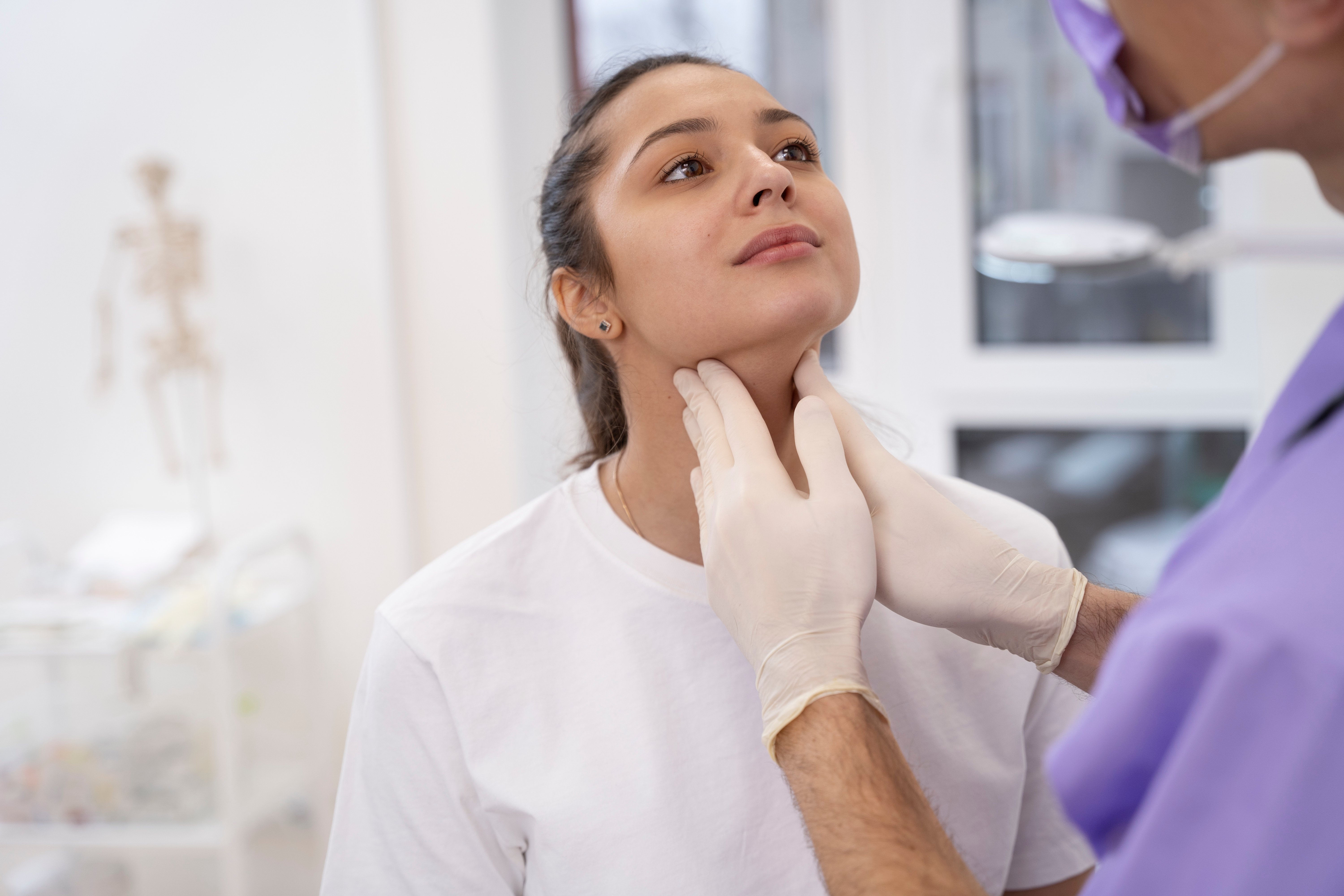 doctor-performing-routine-medical-checkup